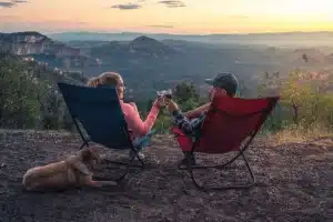 Couple Camping And Watching A Sunset